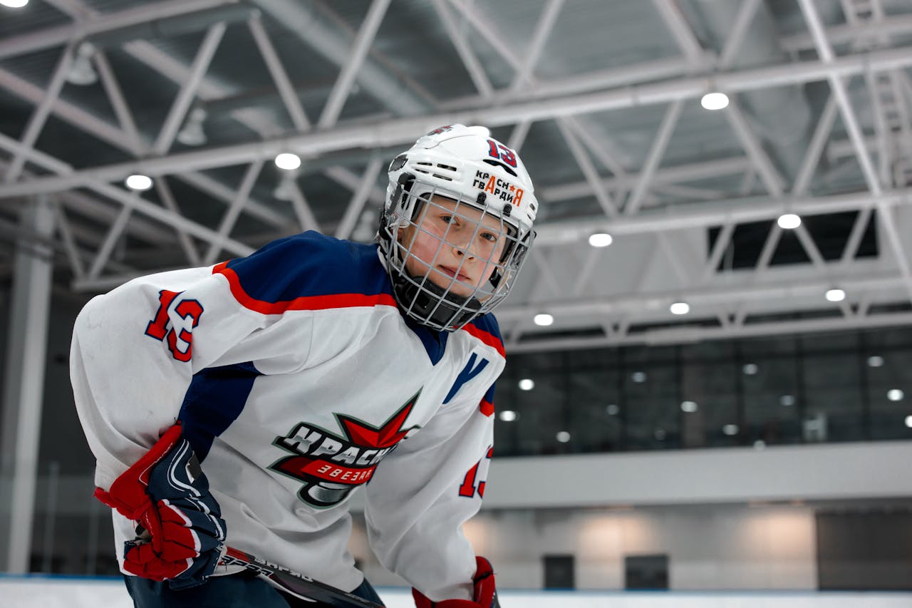 Child dressed in hockey gear